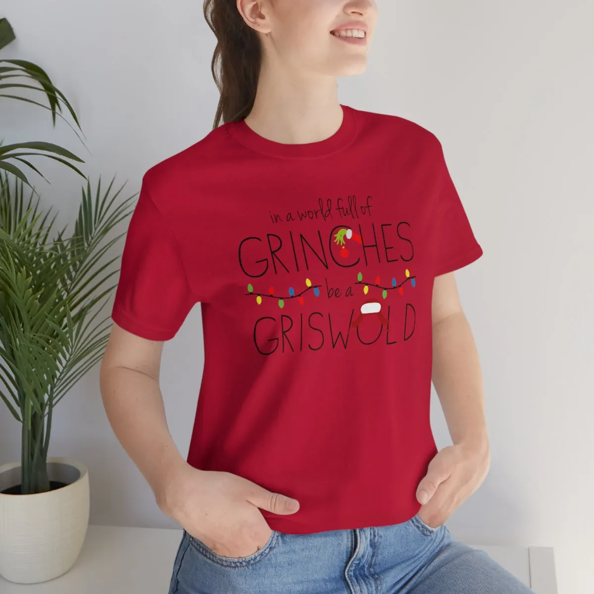 In a world full of GRINCHES be a GRISWOLD-Unisex Jersey Short Sleeve Tee